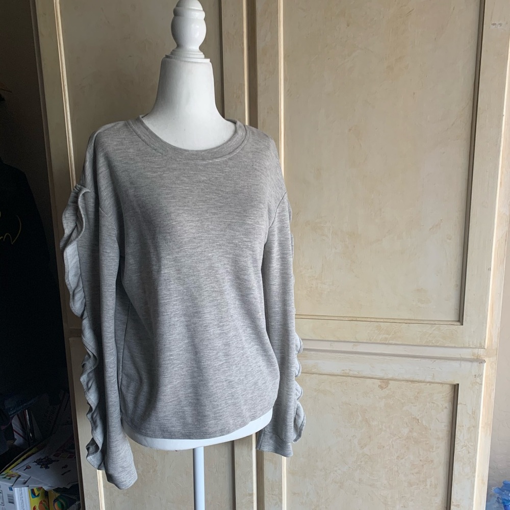 Light grey long sleeve shirt with ruffle detail